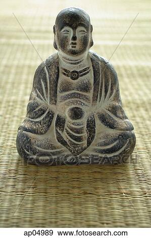 Still life of with small Buddha sculpture View Large Photo Image Stock Photo - Still life of with small Buddha sculpture. Fotosearch