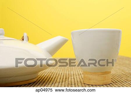 Still life with Chinese teacup and teapot, against yellow wall View Large Photo Image Stock Photography - Still life with Chinese teacup and teapot, against yellow wall. Fotosearch