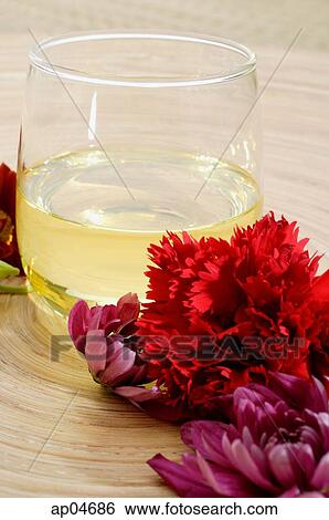 Still life with drink and flowers View Large Photo Image Stock Photograph - Still life with drink and flowers. Fotosearch
