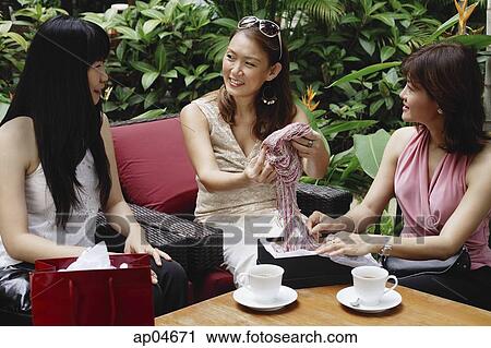 Three women at outdoor garden cafe View Large Photo Image Stock Image - Three women at outdoor garden cafe. Fotosearch
