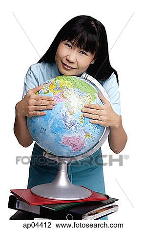 Woman embracing globe, smiling View Large Photo Image Stock Image - Woman embracing globe, smiling. Fotosearch