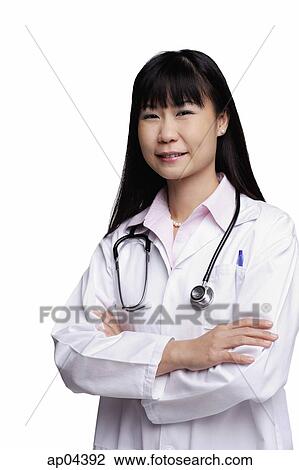 Woman in lab coat, smiling at camera View Large Photo Image Stock Image - Woman in lab coat, smiling at camera. Fotosearch