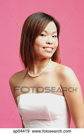 Woman in pink tube top and pearl necklace View Large Photo Image Stock Photo - Woman in pink tube top and pearl necklace. Fotosearch