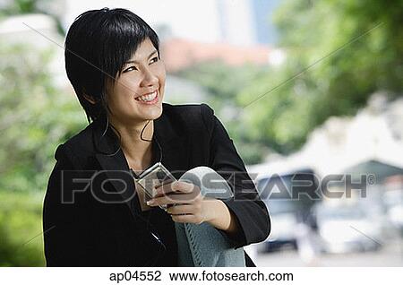 Woman listening to MP3 player View Large Photo Image Stock Image - Woman listening to MP3 player. Fotosearch