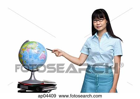 Stock Photo - Woman pointing at globe. Fotosearch