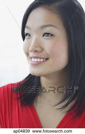 Stock Photo - Woman smiling, head shot. Fotosearch