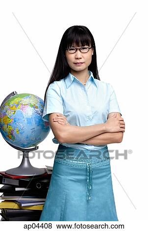 Stock Photo - Woman standing next to globe and books. Fotosearch