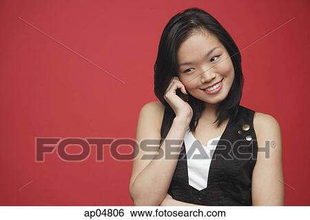 Woman using mobile phone, looking away View Large Photo Image Stock Photograph - Woman using mobile phone, looking away. Fotosearch