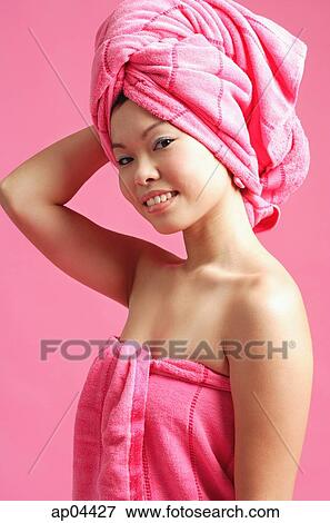 Woman wearing pink towel View Large Photo Image Stock Photo - Woman wearing pink towel. Fotosearch