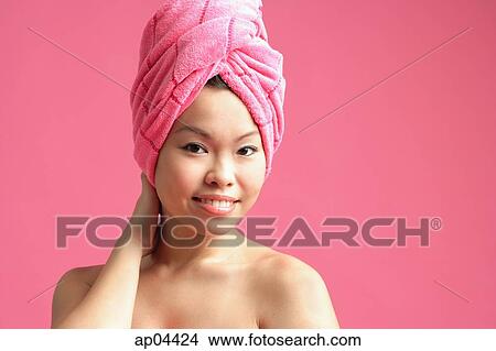 Woman wearing pink towel turban View Large Photo Image Picture - Woman wearing pink towel turban. Fotosearch