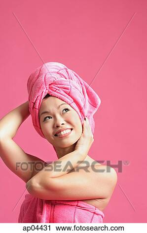 Woman wearing pink turban, looking away View Large Photo Image Stock Image - Woman wearing pink turban, looking away. Fotosearch