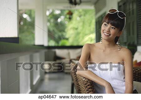 Young woman in white tube top, looking away View Large Photo Image Stock Photo - Young woman in white tube top, looking away. Fotosearch