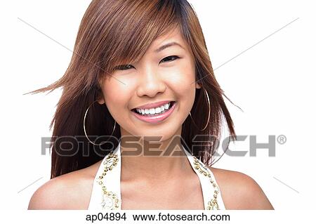 Picture - Young woman looking at camera, smiling. Fotosearch