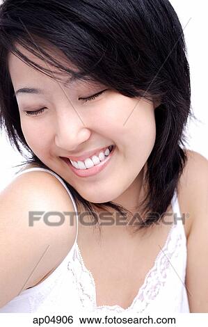 Young woman with eyes closed, head shot View Large Photo Image Stock Photograph - Young woman with eyes closed, head shot. Fotosearch