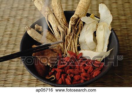 Stock Photograph - Bowl filled with Chinese medicinal herbs. Fotosearch