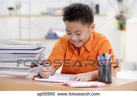 Boy doing homework View Large Photo Image Stock Image - Boy doing homework. Fotosearch
