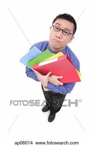 Picture - Businessman carrying multi coloured folders, sad expression. Fotosearch