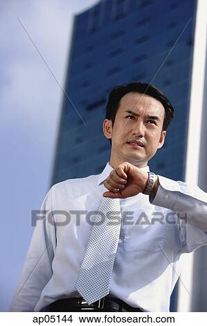 Businessman frowning, looking away View Large Photo Image Picture - Businessman frowning, looking away. Fotosearch