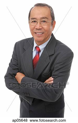 Businessman looking at camera, smiling View Large Photo Image Stock Photo - Businessman looking at camera, smiling. Fotosearch