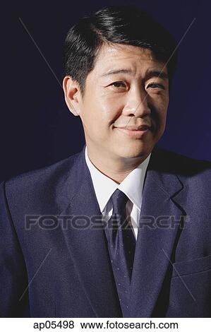 Stock Photo - Businessman, looking at camera. Fotosearch