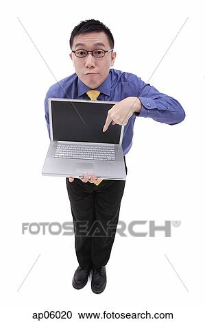 Businessman pointing at laptop View Large Photo Image Stock Image - Businessman pointing at laptop. Fotosearch