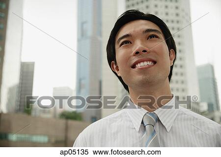 Stock Photography - Businessman smiling, head shot. Fotosearch