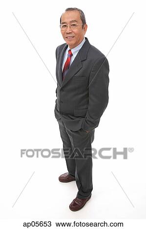 Businessman standing with hands in pocket View Large Photo Image Stock Image - Businessman standing with hands in pocket. Fotosearch