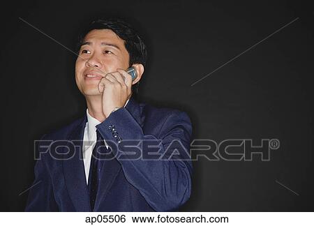 Businessman using mobile phone View Large Photo Image Stock Photograph - Businessman using mobile phone. Fotosearch