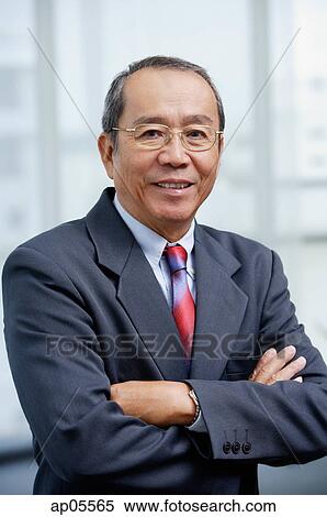 Stock Photography - Businessman with arms crossed. Fotosearch