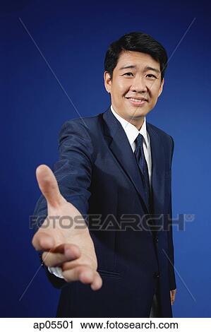 Businessman with hand outstretched View Large Photo Image Stock Image - Businessman with hand outstretched. Fotosearch