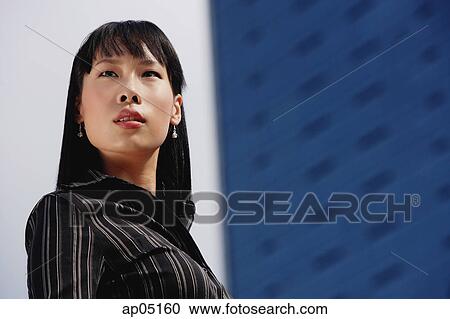 Businesswoman looking away, head shot View Large Photo Image Stock Image - Businesswoman looking away, head shot. Fotosearch