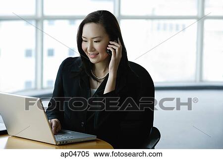 Businesswoman using laptop View Large Photo Image Stock Photography - Businesswoman using laptop. Fotosearch