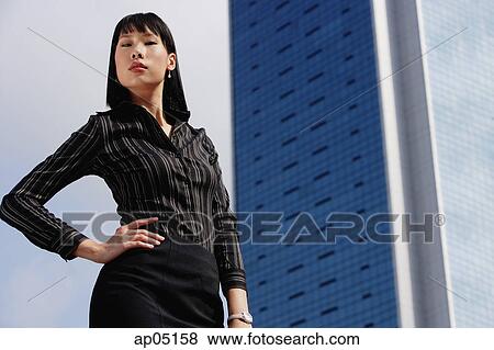 Businesswoman with hand on hip, portrait View Large Photo Image Stock Photo - Businesswoman with hand on hip, portrait. Fotosearch