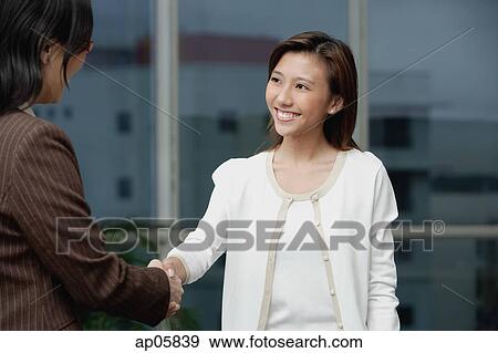 Businesswomen shaking hands View Large Photo Image Stock Photo - Businesswomen shaking hands. Fotosearch