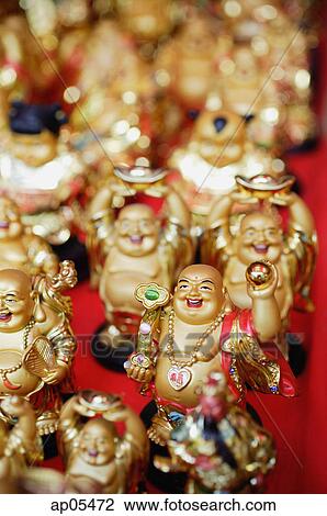 Stock Image - Chinese Laughing Buddhas, Sill Life. Fotosearch