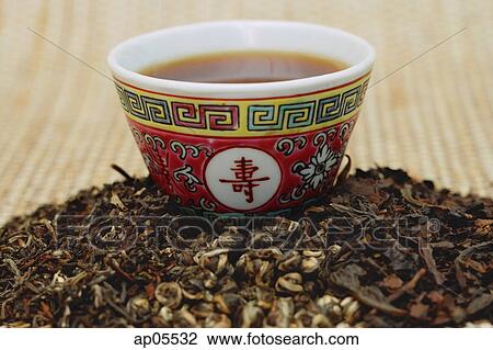 Chinese teacup and pile of loose tea leaves View Large Photo Image Stock Image - Chinese teacup and pile of loose tea leaves. Fotosearch
