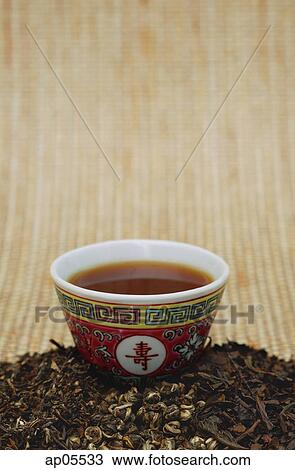Chinese teacup and pile of loose tea leaves, still life View Large Photo Image Stock Image - Chinese teacup and pile of loose tea leaves, still life. Fotosearch