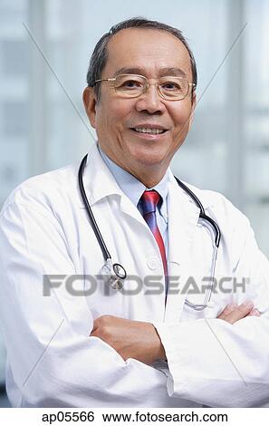 Doctor with arms crossed View Large Photo Image Stock Photograph - Doctor with arms crossed. Fotosearch