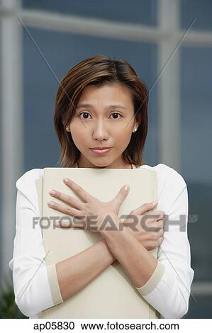 Female executive hugging folders, sad expression View Large Photo Image Stock Image - Female executive hugging folders, sad expression. Fotosearch