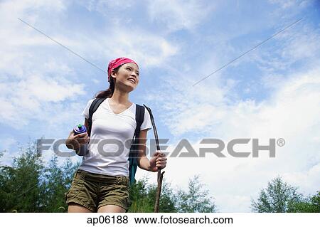 Female hiker, low angle view View Large Photo Image Stock Photo - Female hiker, low angle view. Fotosearch