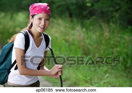 Female hiker smiling at camera View Large Photo Image Stock Photography - Female hiker smiling at camera. Fotosearch