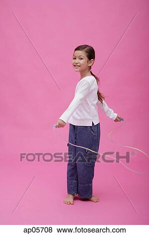 Girl with skipping rope View Large Photo Image Stock Photo - Girl with skipping rope. Fotosearch