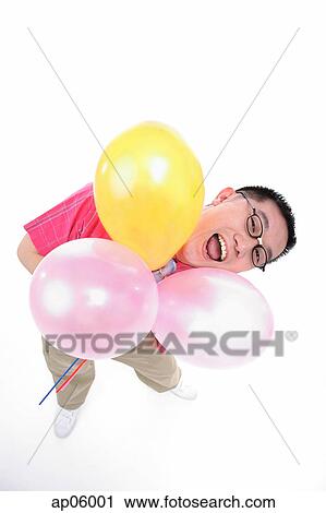 Man holding three balloons, looking up at camera, mouth open View Large Photo Image Stock Image - Man holding three balloons, looking up at camera, mouth open. Fotosearch
