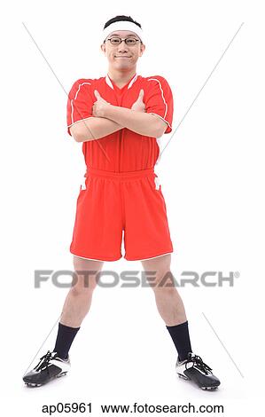 Man in soccer uniform, arms crossed, smiling at camera View Large Photo Image Stock Image - Man in soccer uniform, arms crossed, smiling at camera. Fotosearch