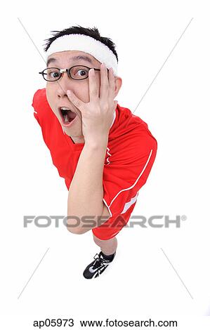 Man in soccer uniform looking at camera, hand on face View Large Photo Image Stock Image - Man in soccer uniform looking at camera, hand on face. Fotosearch