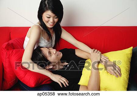 Man lying on woman's lap View Large Photo Image Stock Photo - Man lying on woman's lap. Fotosearch