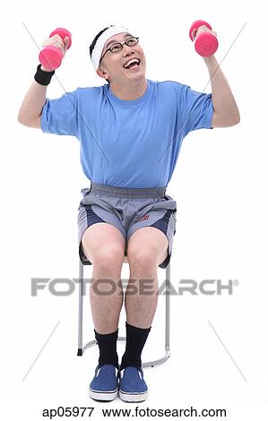 Man sitting on stool, lifting dumbbells View Large Photo Image Stock Photo - Man sitting on stool, lifting dumbbells. Fotosearch