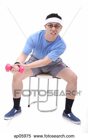 Man sitting on stool, using dumbbell View Large Photo Image Stock Photography - Man sitting on stool, using dumbbell. Fotosearch