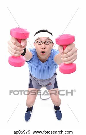 Man using dumbbells, high angle view View Large Photo Image Stock Photo - Man using dumbbells, high angle view. Fotosearch