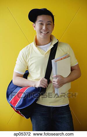 Man with book bag and books View Large Photo Image Stock Image - Man with book bag and books. Fotosearch